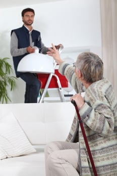 older lady talking to handman