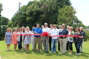 TruBlue Owners Cutting a Ribbon