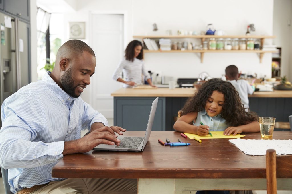 Busy Family sitting in a kitchen