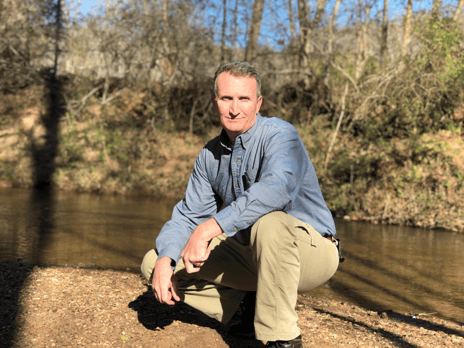 Jay Lowery posing in the forest