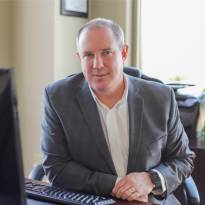 Sean Fitzgerald sitting at his desk