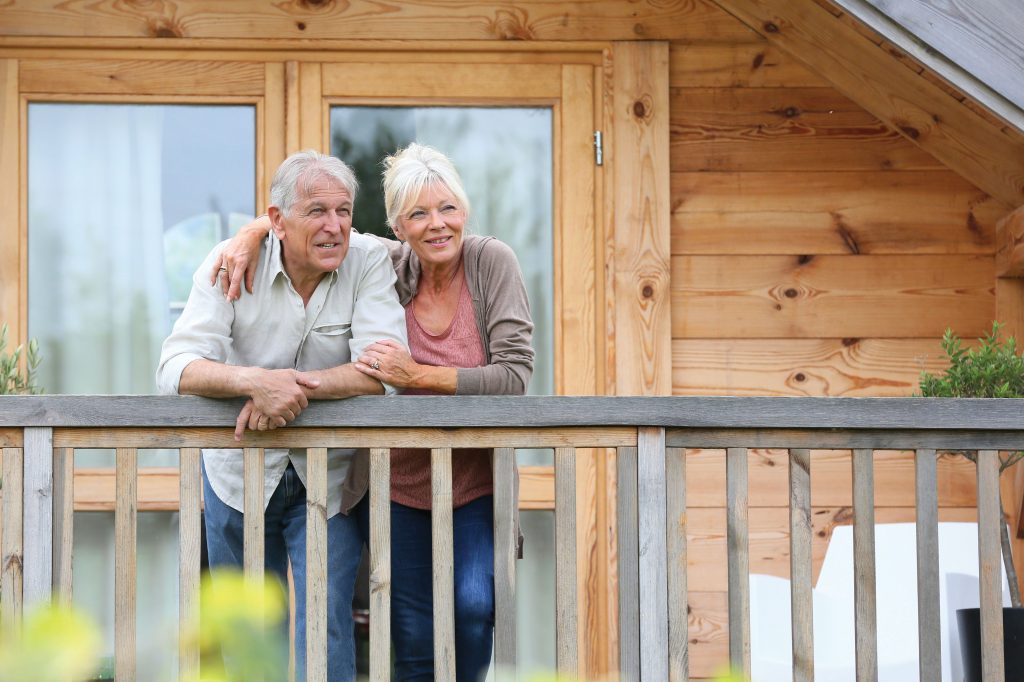 Seniors standing on a balcony